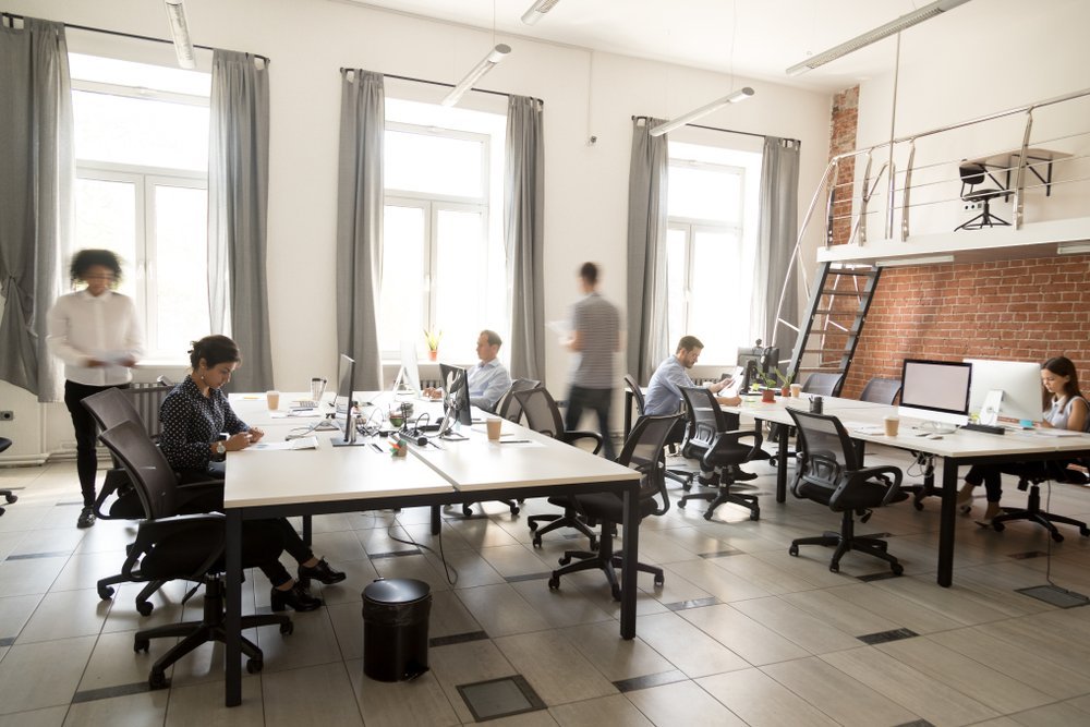 Busy office space with focused employees Busy office space with focused employees