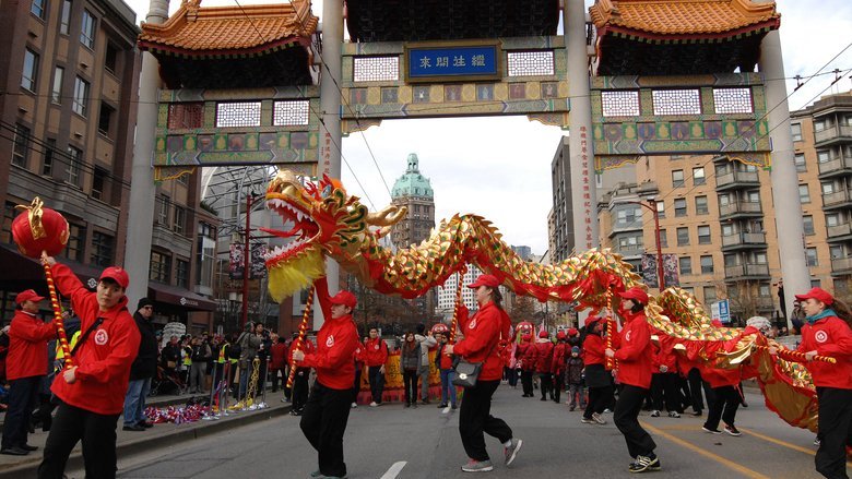 People Holding Dragon During Parade on Pender Street in Vancouver's Chinatown People Holding Dragon During Parade on Pender Street in Vancouver's Chinatown