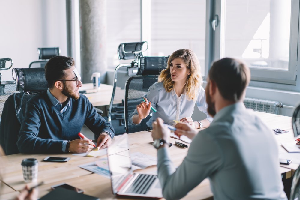 Colleagues working together in office space Colleagues working together in office space