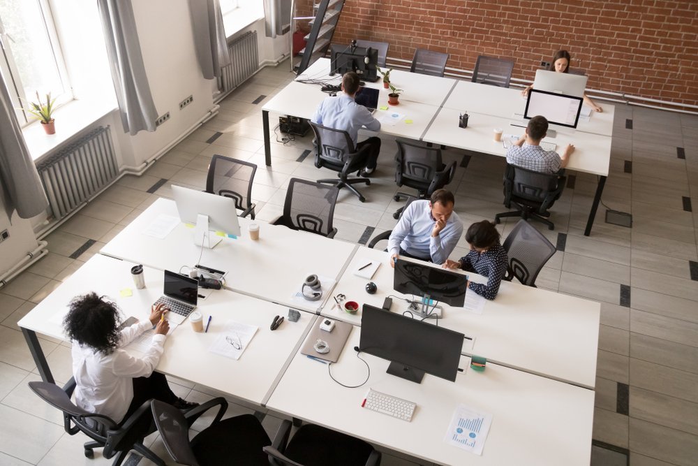 Colleagues working together in office space Colleagues working together in office space