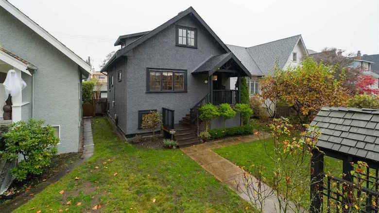 Grey house with black trim for sale on King Edward Ave. Grey house with black trim for sale on King Edward Ave.