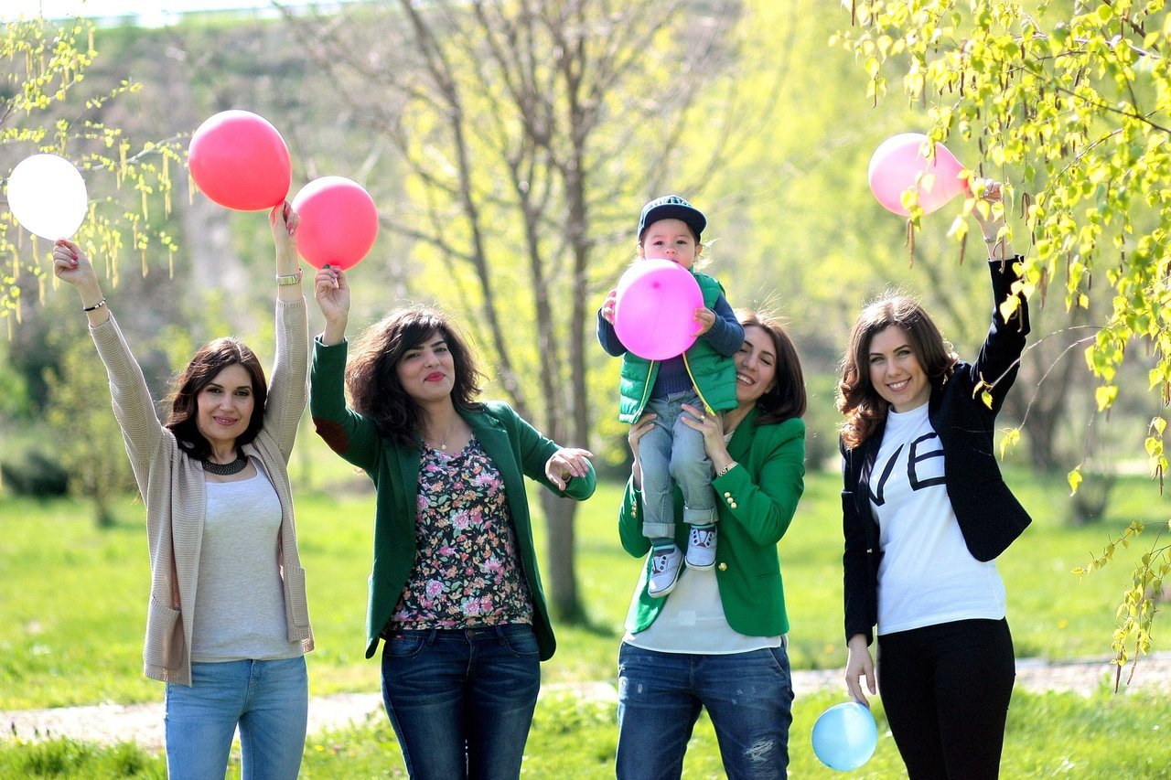 family holding up balloons family holding up balloons