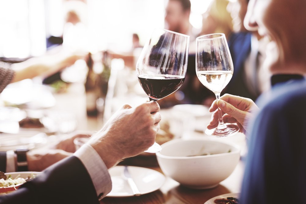 Enjoying fine wine at a dinner party Enjoying fine wine at a dinner party