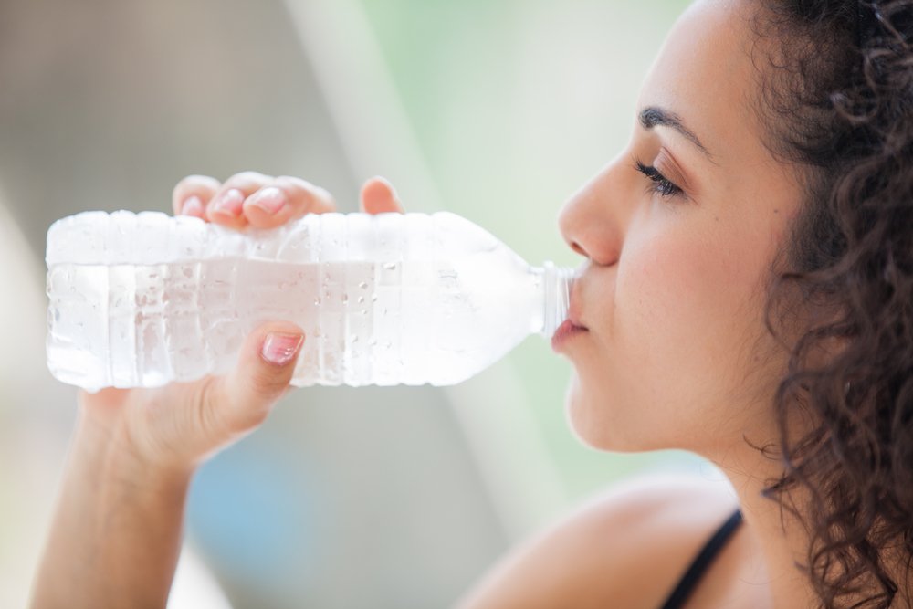 Teen girl drinking water Teen girl drinking water