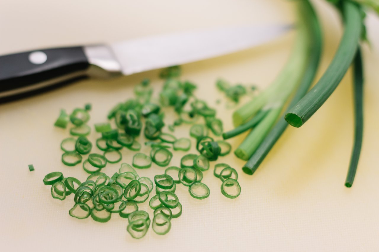 knife and vegetable on chopping board