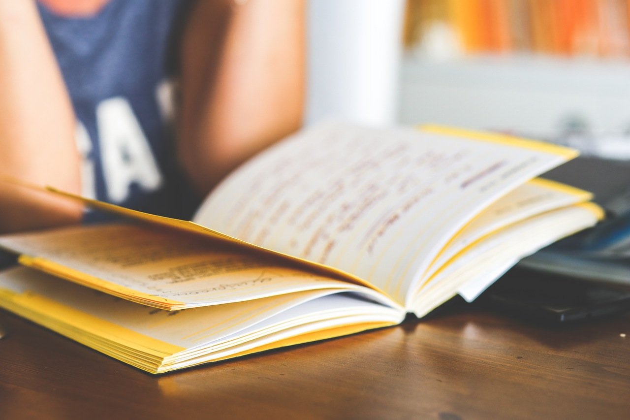 teen reading a book teen reading a book