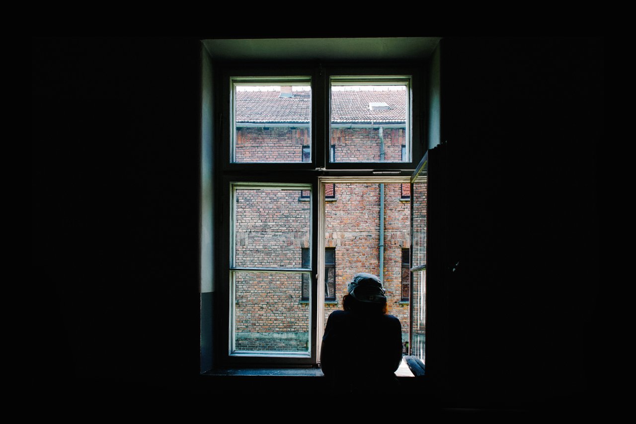teen staring out window alone teen staring out window alone