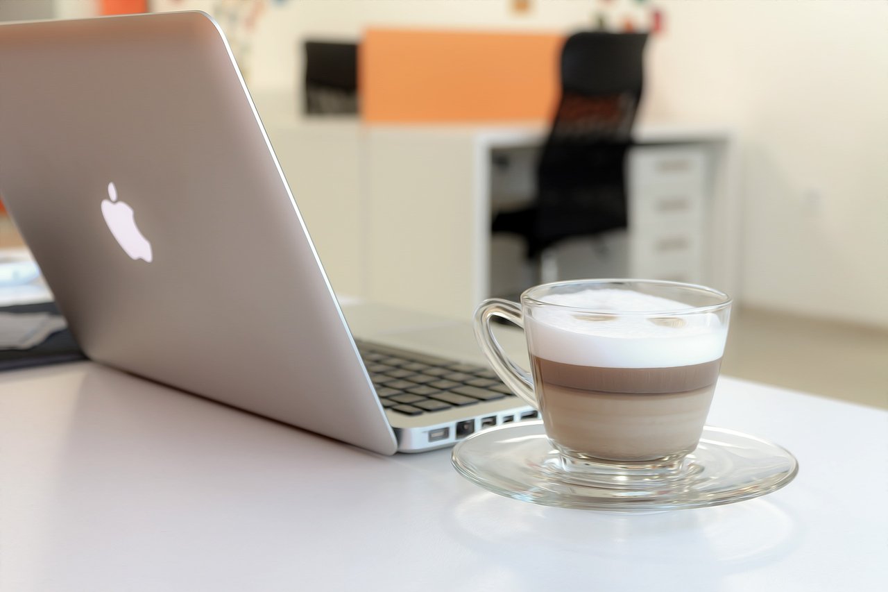 laptop and coffee on office desk laptop and coffee on office desk