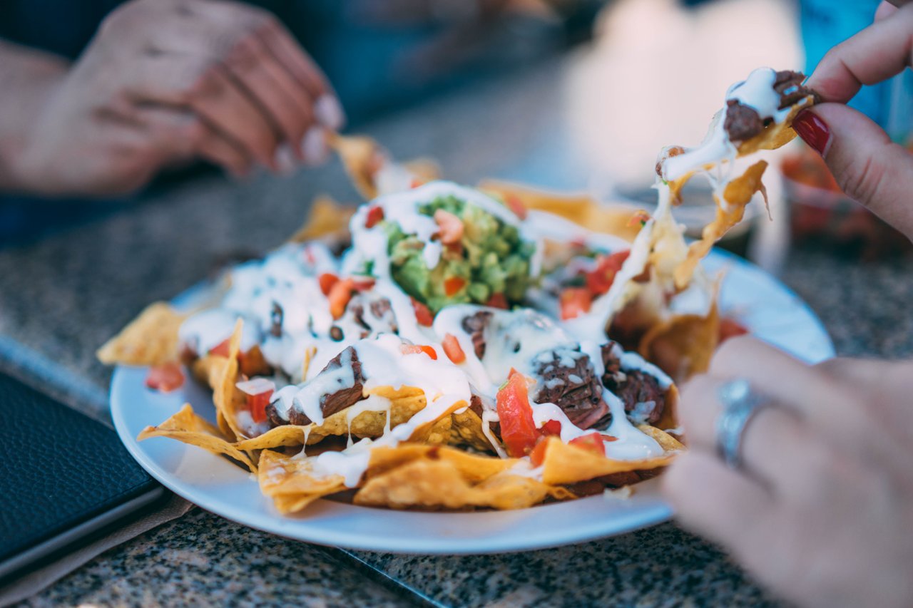 people eating nachos people eating nachos