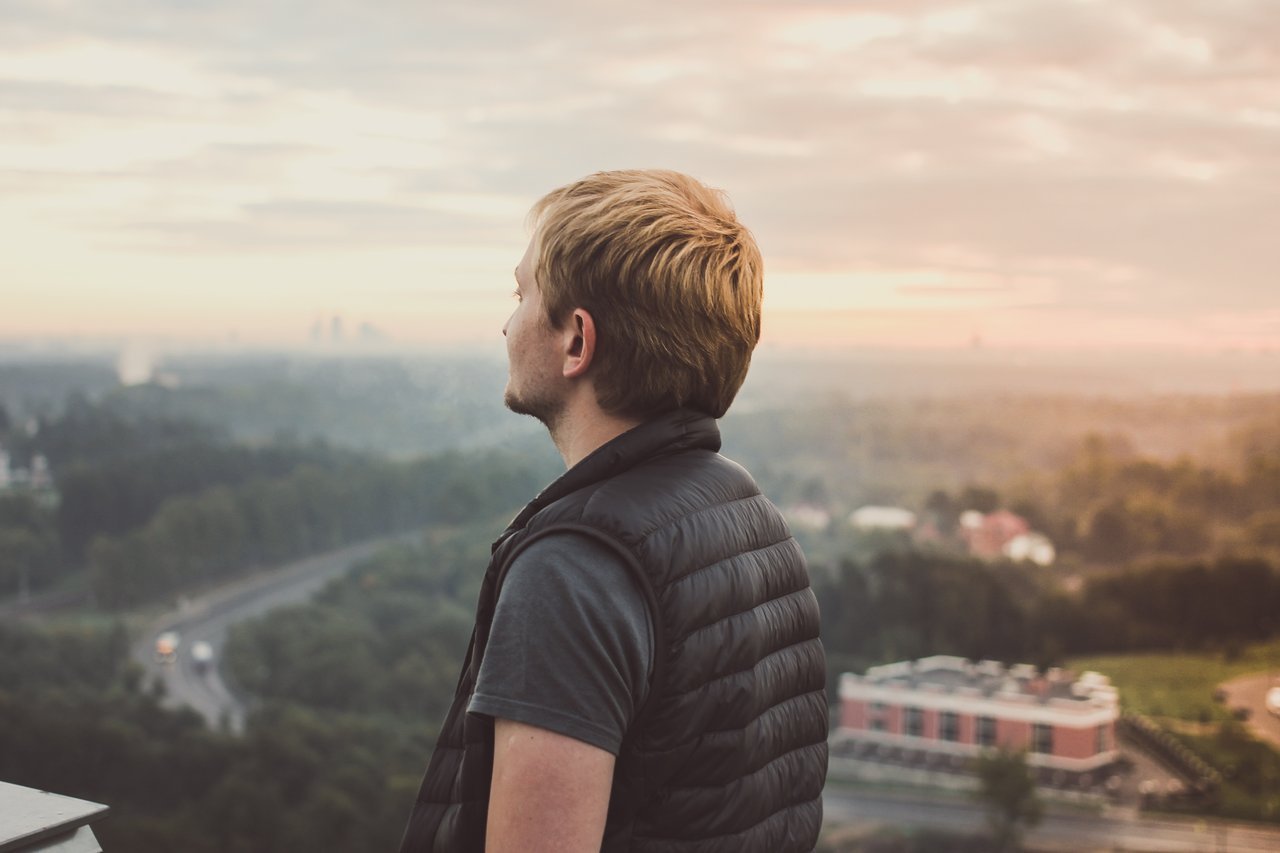 Man on a hilltop looking out Man on a hilltop looking out