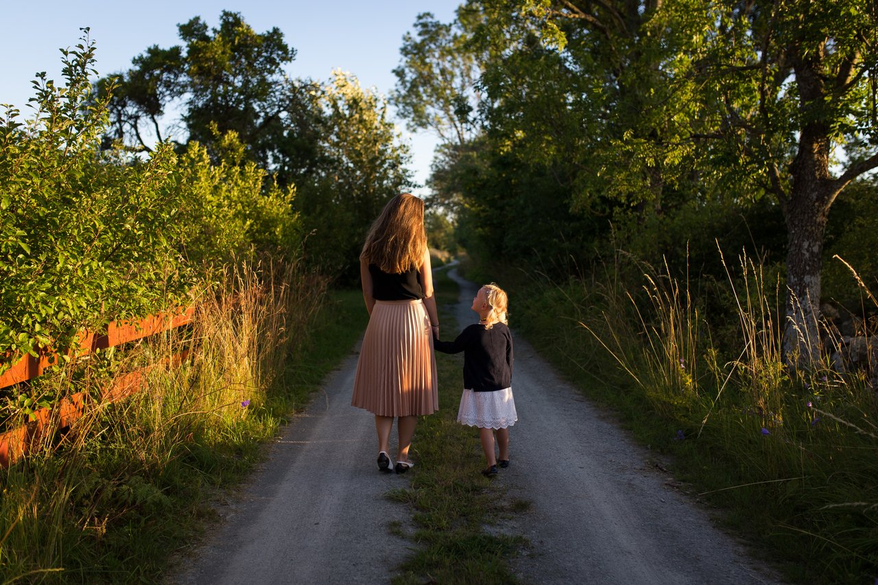 Mother walking to school with daughter Mother walking to school with daughter