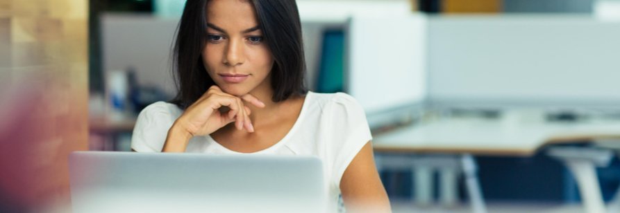 Women looking at computer screen in professional office Women looking at computer screen in professional office