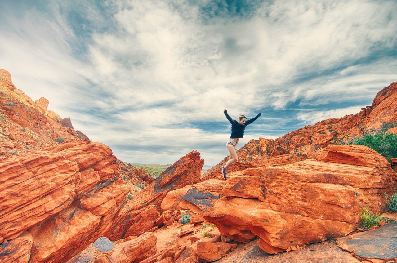 Teen jumping and running in picturesque national park Teen jumping and running in picturesque national park