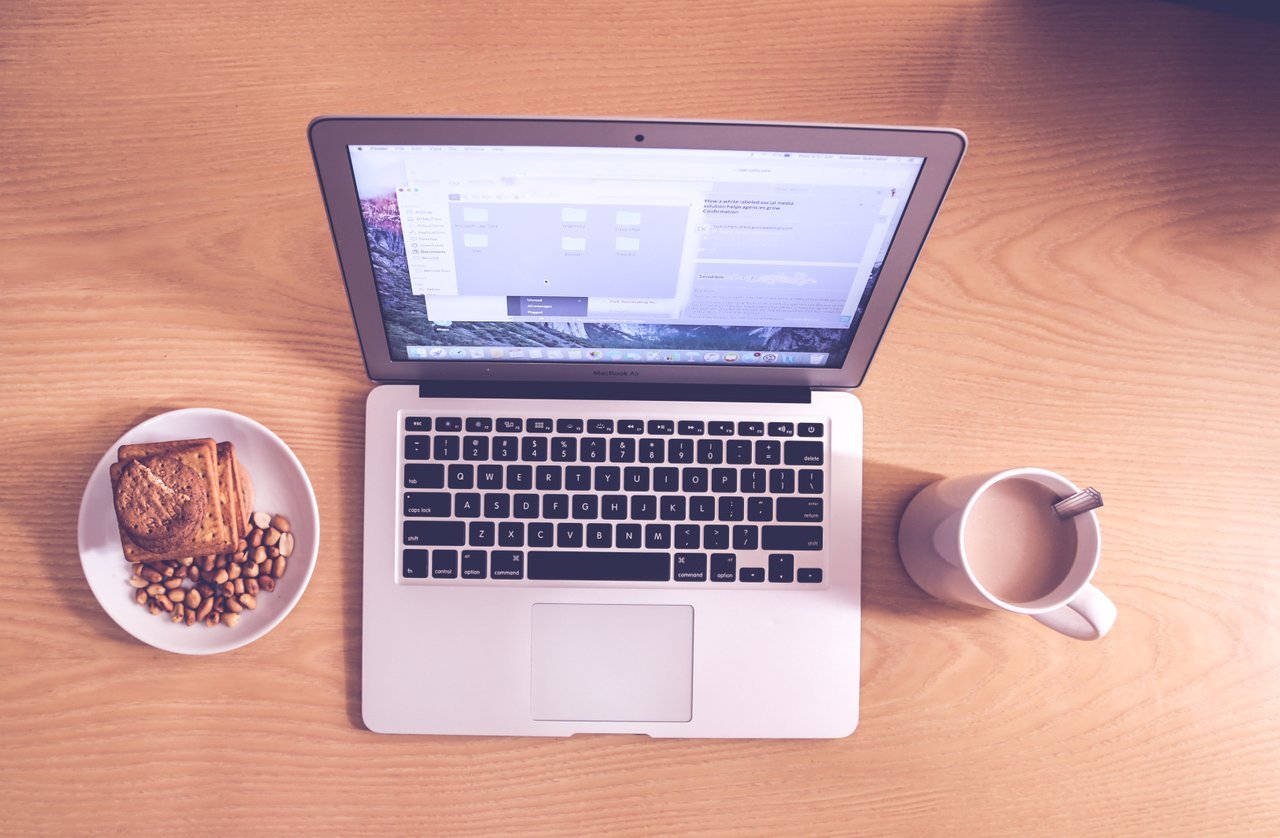 open laptop with coffee and snacks open laptop with coffee and snacks