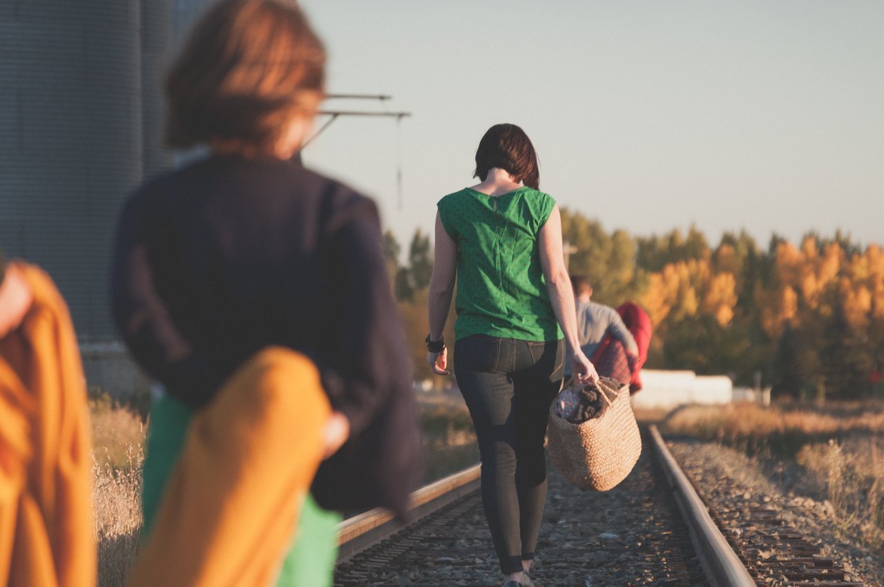Family walking on railroad tracks Family walking on railroad tracks