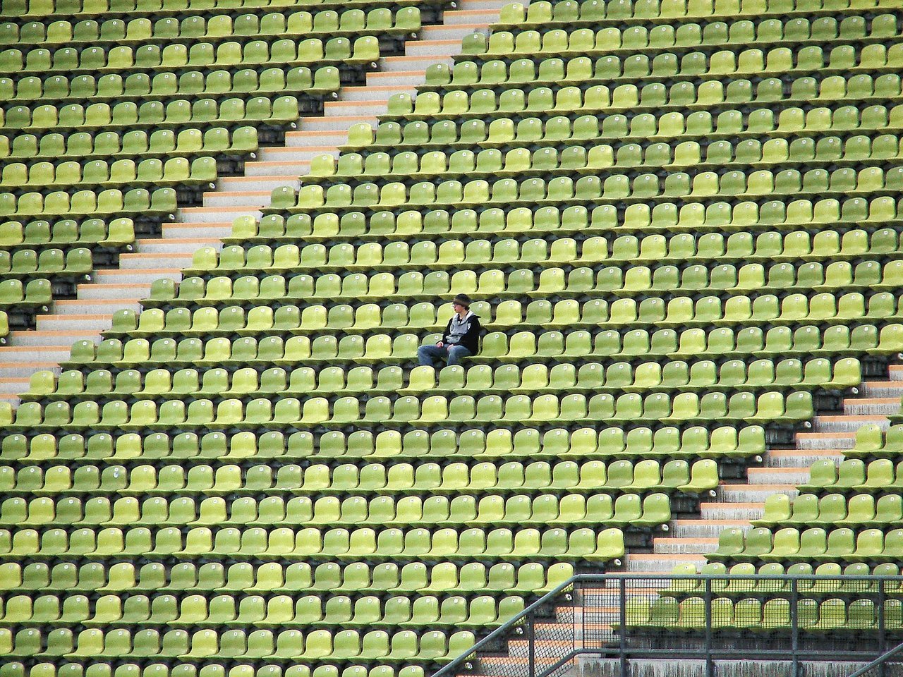 Teen sitting alone in bleachers Teen sitting alone in bleachers