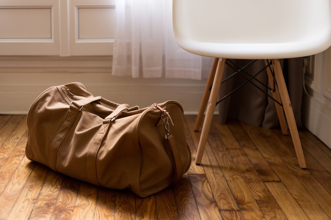 luggage and chair in a room luggage and chair in a room
