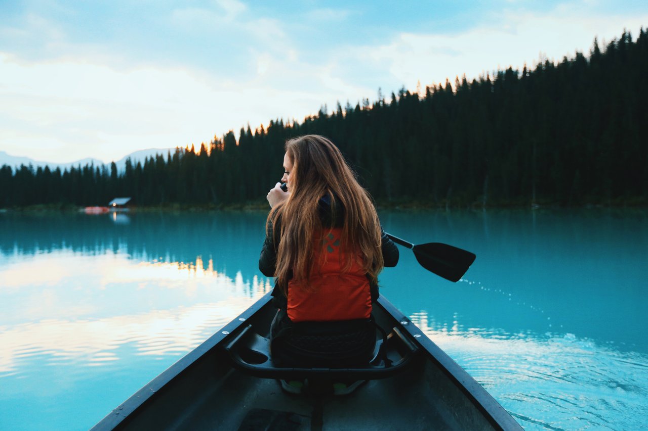Teen navigating in canoe Teen navigating in canoe