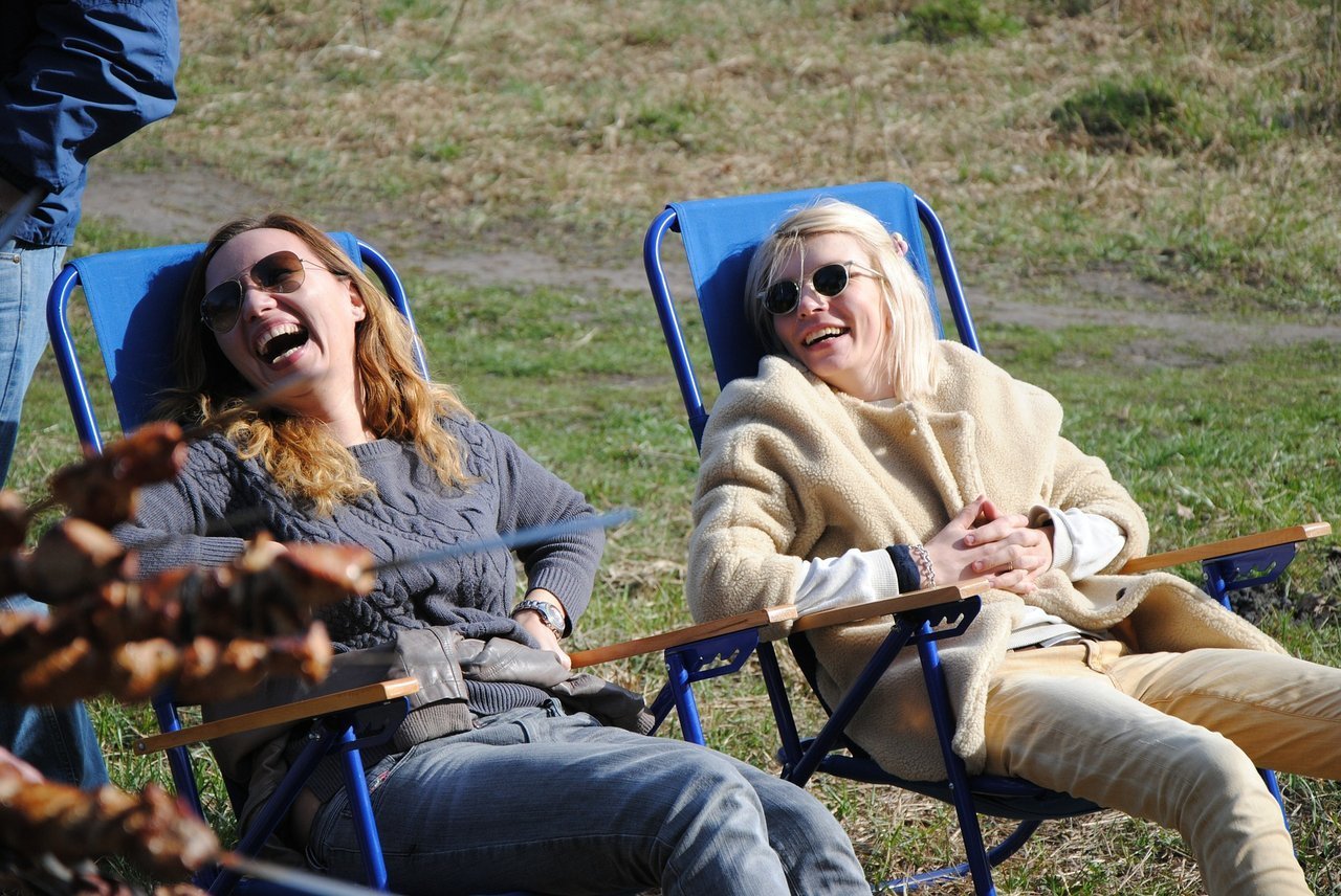 teens sitting outside and laughing teens sitting outside and laughing