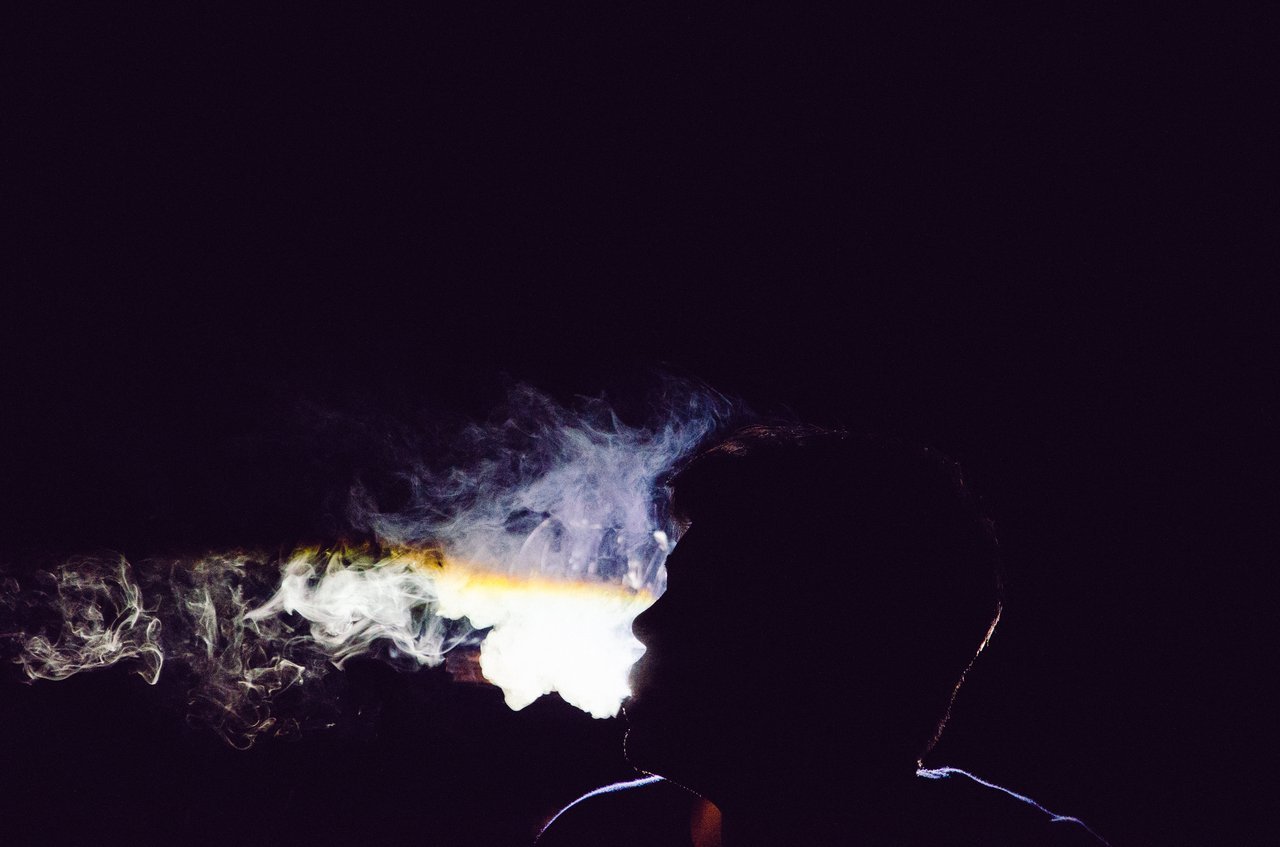 guy exhaling smoke guy exhaling smoke