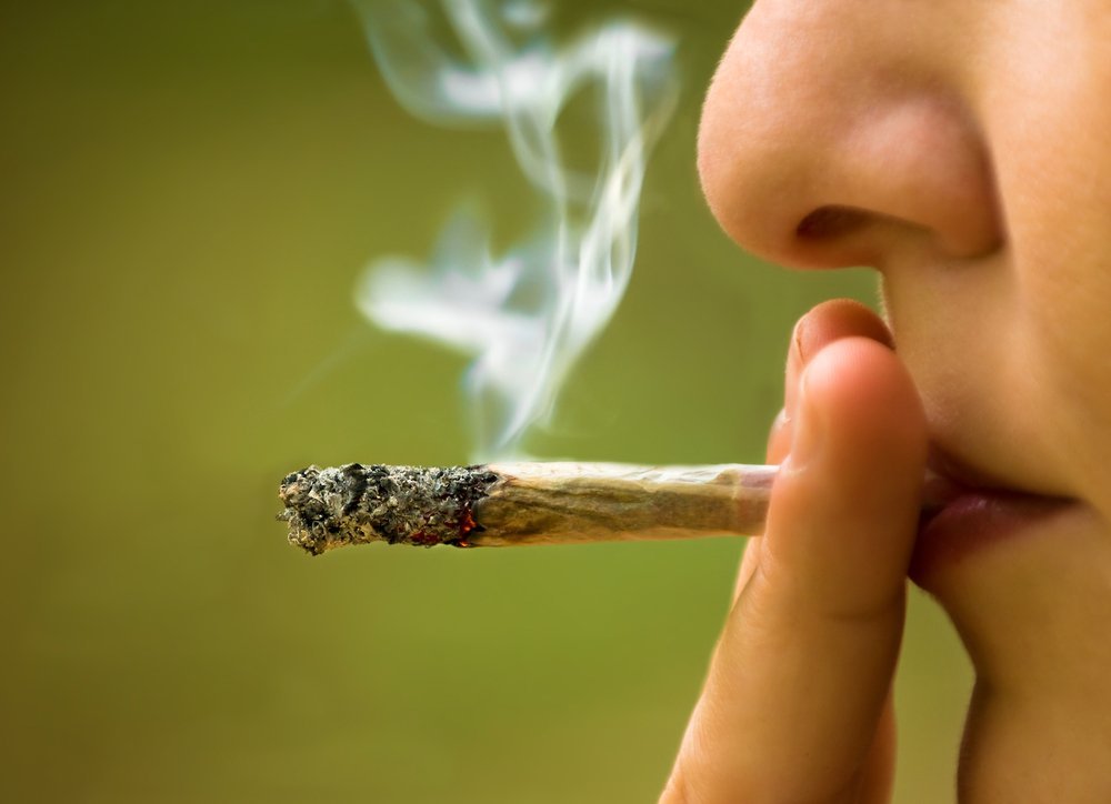 Teen smoking marijuana joint Teen smoking marijuana joint